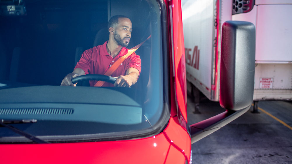 safety driver in cabin making a rear move